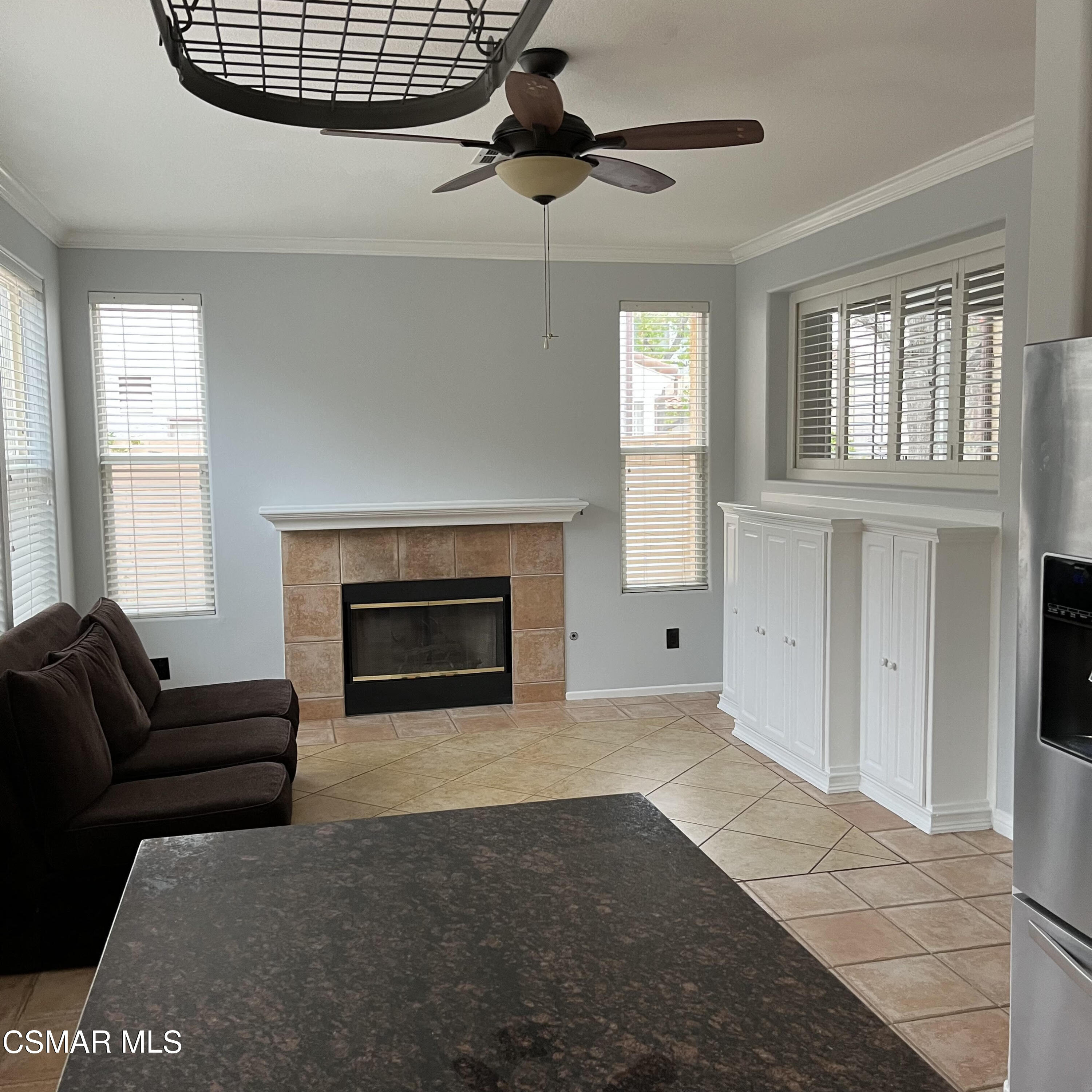 3906 Prato Court Moorpark, CA 93021 - Photo 13 of 51 a living room with furniture a fireplace and a window