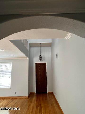 3906 Prato Court Moorpark, CA 93021 - Photo 6 of 51 a view of a hallway with wooden floor and a cabinet