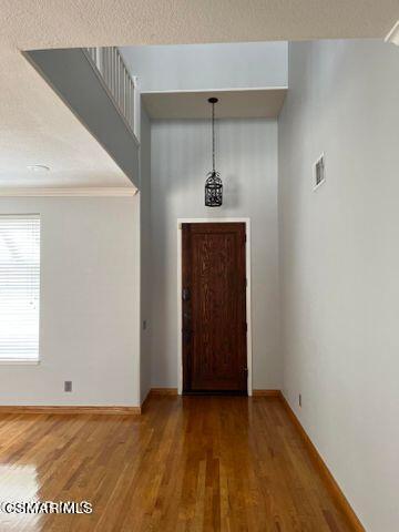3906 Prato Court Moorpark, CA 93021 - Photo 7 of 51 a view of an empty room with window and wooden floor