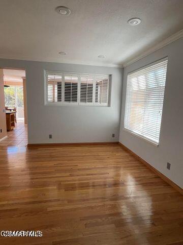 3906 Prato Court Moorpark, CA 93021 - Photo 10 of 51 an empty room with wooden floor and windows
