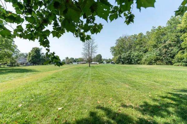 a backyard of a house with lots of green space