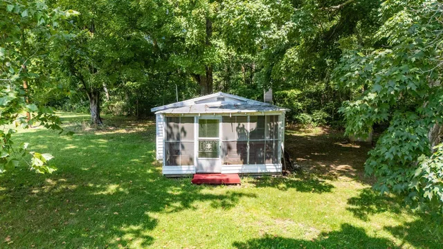 a front view of a house with yard