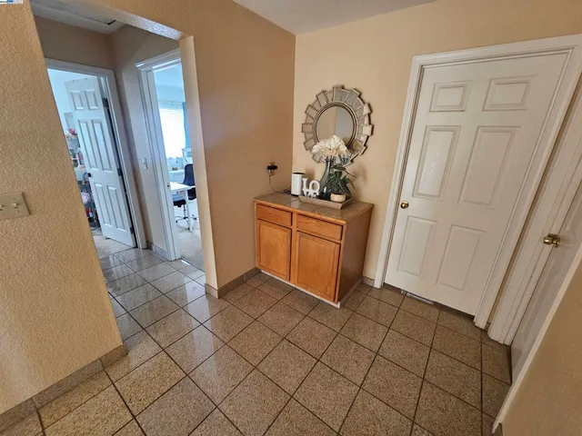 a room with washing machine and cabinets