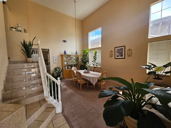 a view of a livingroom with furniture and entryway