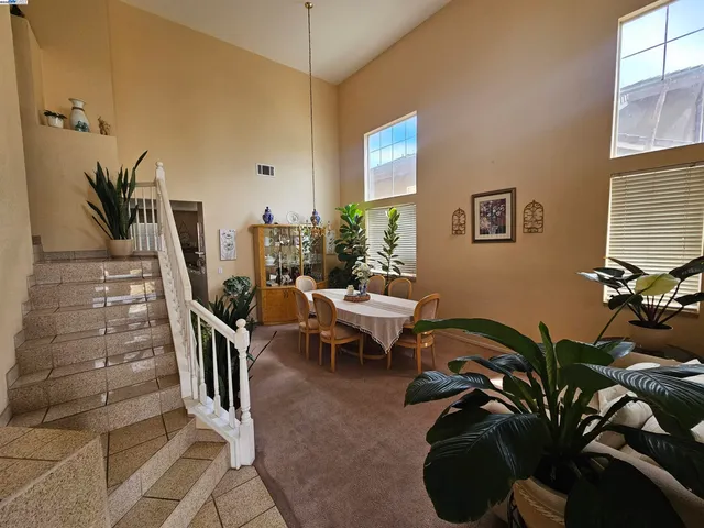 a view of a livingroom with furniture and entryway