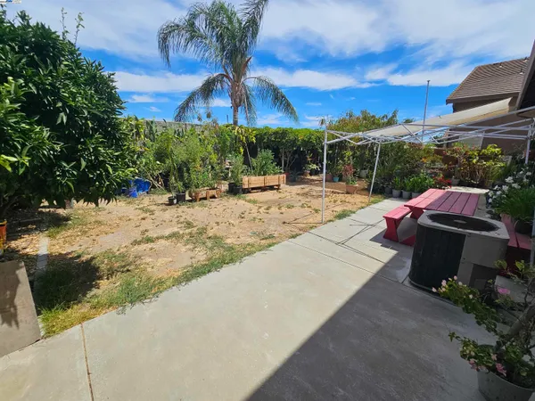 a view of a backyard with a patio