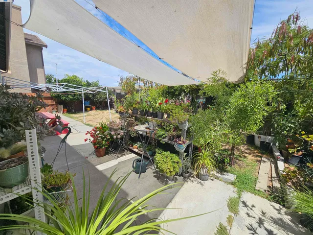 a view of a chairs and table in a patio