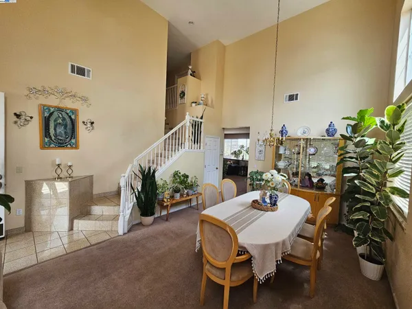 a view of a livingroom with furniture and a potted plant