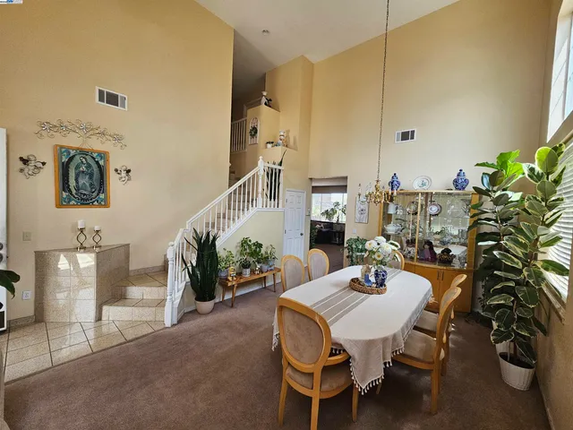 a view of a livingroom with furniture and a potted plant