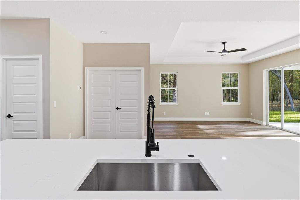 19126 Southwest 101st Street Dunnellon, FL 34432 - Photo 14 of 46 a view of a living room with a ceiling fan