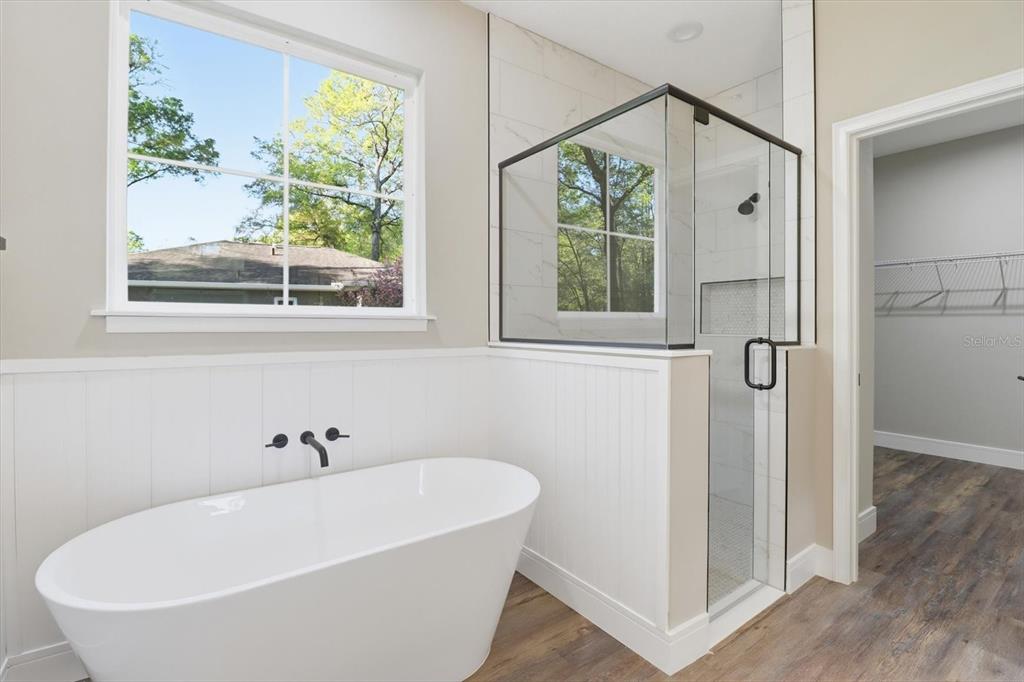 19126 Southwest 101st Street Dunnellon, FL 34432 - Photo 20 of 46 a white bath tub sitting next to a window