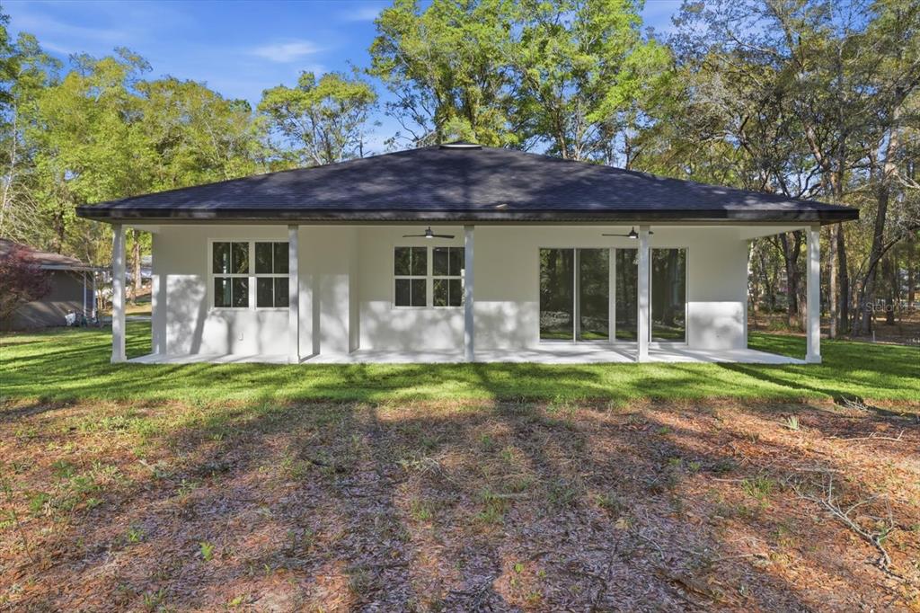 19126 Southwest 101st Street Dunnellon, FL 34432 - Photo 26 of 46 a view of a house with backyard porch and garden