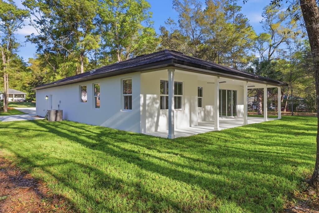19126 Southwest 101st Street Dunnellon, FL 34432 - Photo 27 of 46 a front view of house with yard and green space