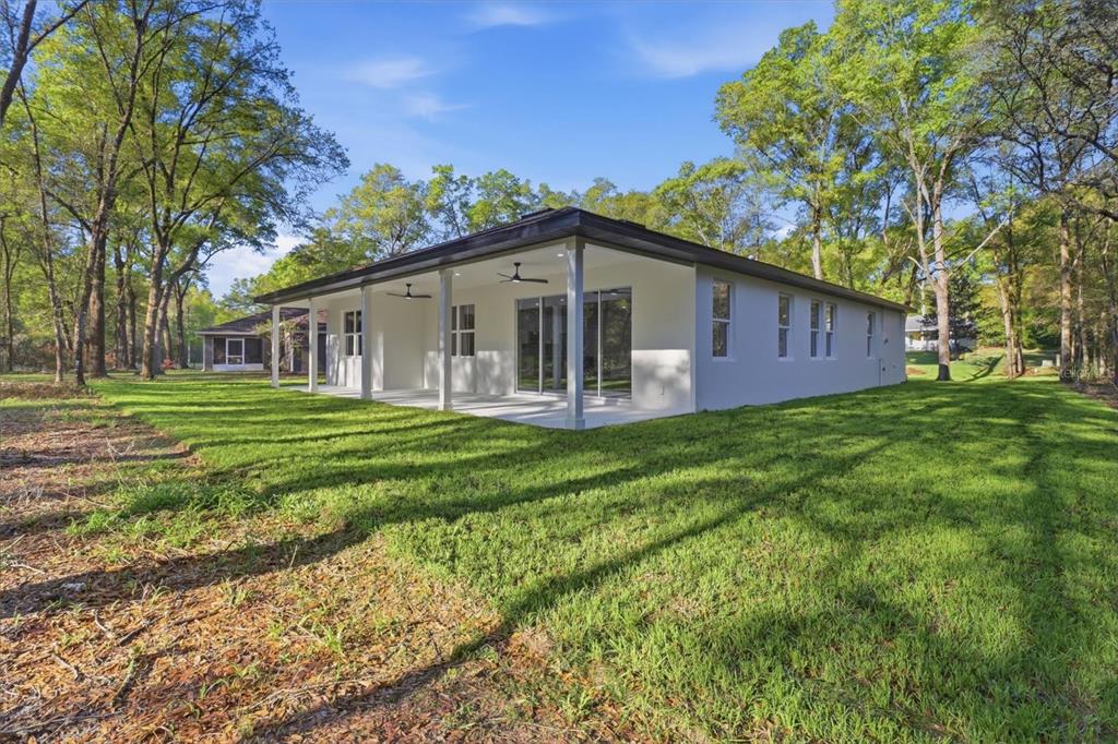 19126 Southwest 101st Street Dunnellon, FL 34432 - Photo 28 of 46 a front view of house with yard and green space