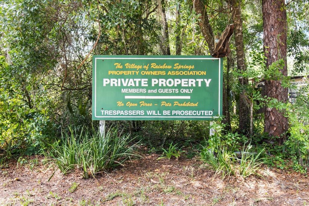 19126 Southwest 101st Street Dunnellon, FL 34432 - Photo 32 of 46 a sign on the side of a road