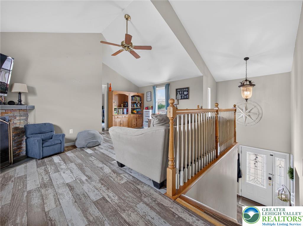 2628 Levans Road Coplay, PA 18037 - Photo 27 of 54 Enter into a welcoming interior boasting soaring vaulted ceilings and distressed hardwood-style flooring.