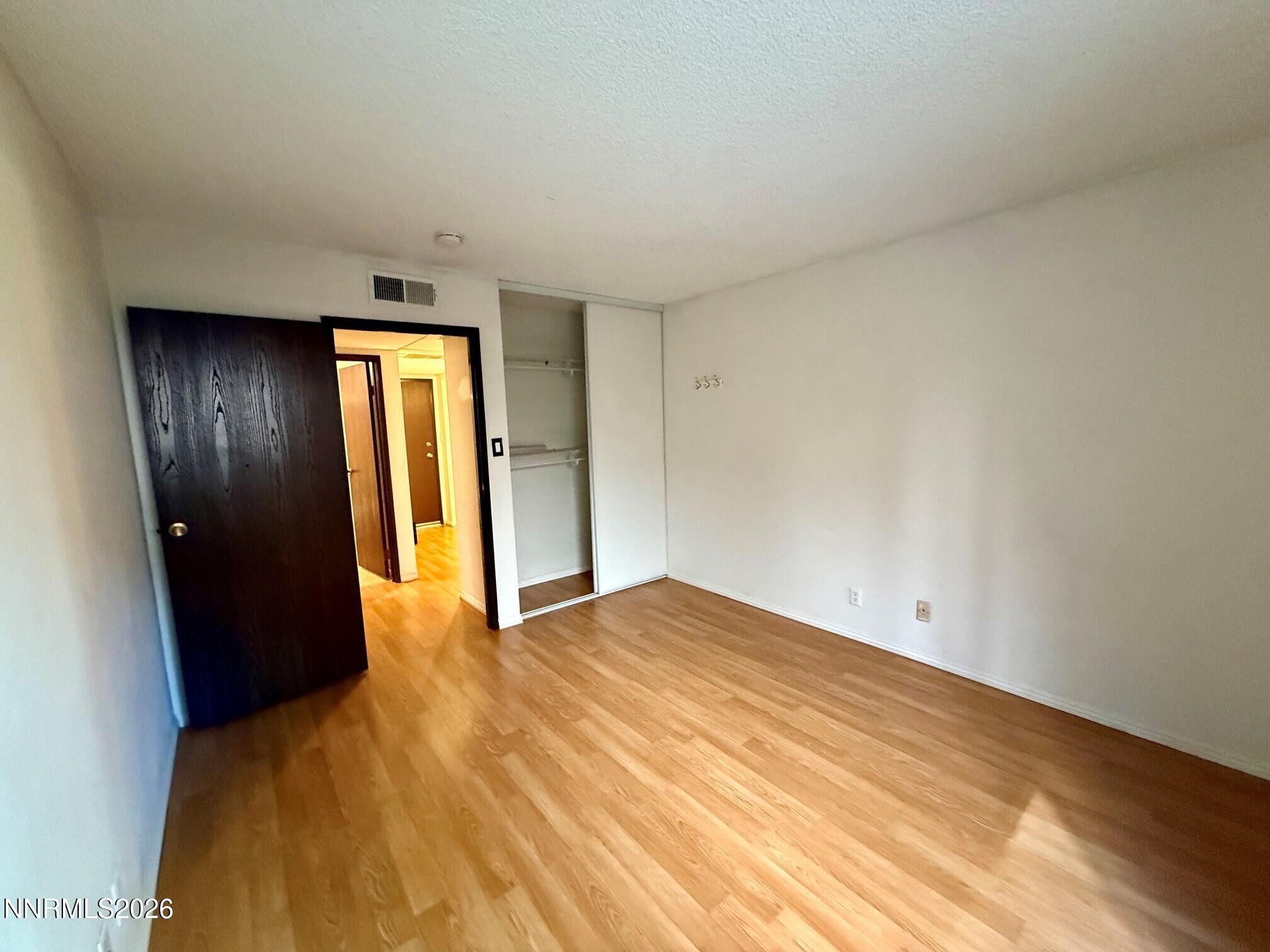 2955 Lakeside Drive, Unit 120 Reno, NV 89509 - Photo 5 of 21 a view of an empty room with closet and a window