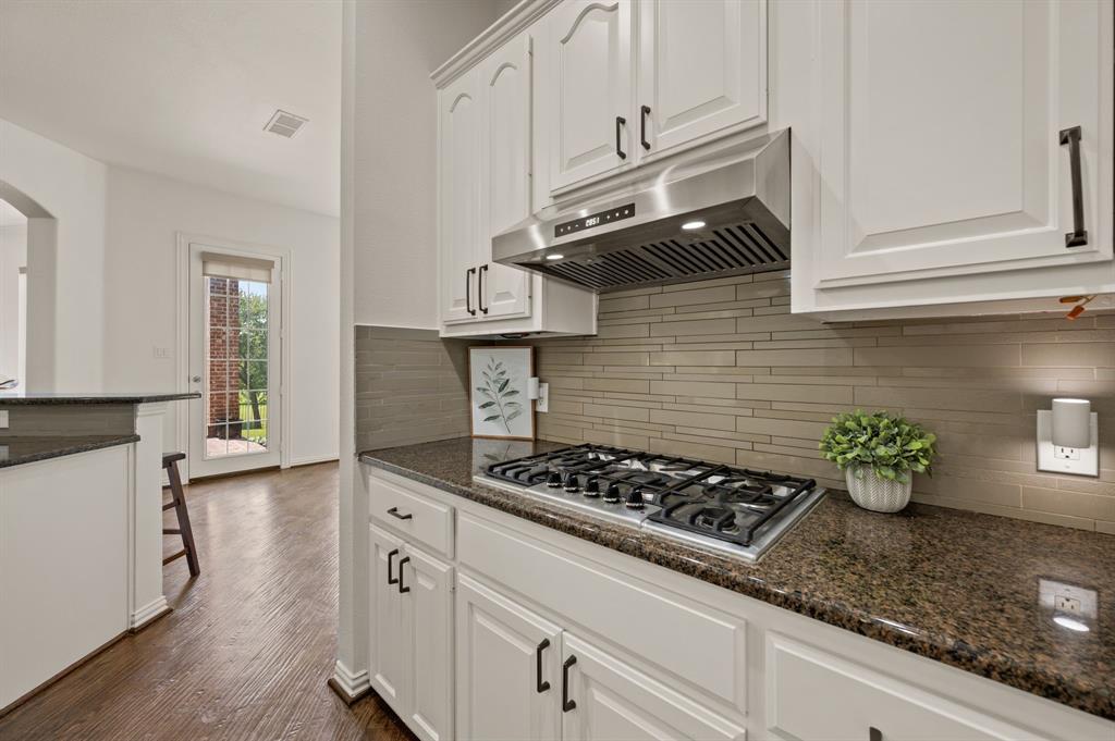 2038 Azalea Trail Irving, TX 75063 - Photo 17 of 39 a kitchen with stainless steel appliances granite countertop a sink stove and cabinets