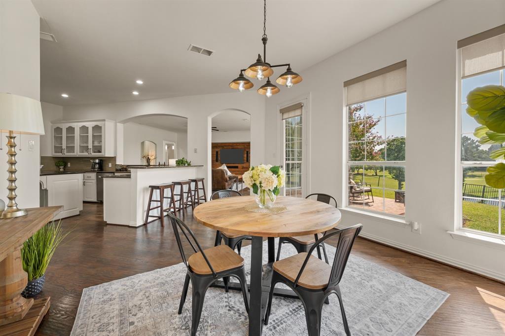 2038 Azalea Trail Irving, TX 75063 - Photo 19 of 39 a view of a dining room with furniture window and wooden floor