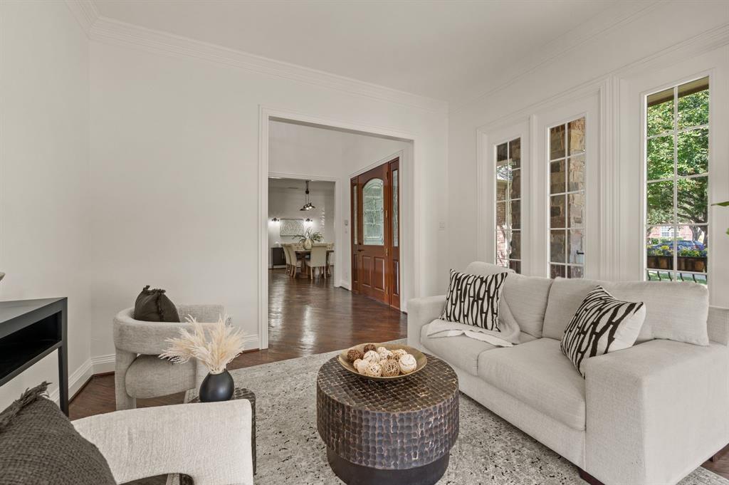 2038 Azalea Trail Irving, TX 75063 - Photo 21 of 39 a living room with furniture and a floor to ceiling window