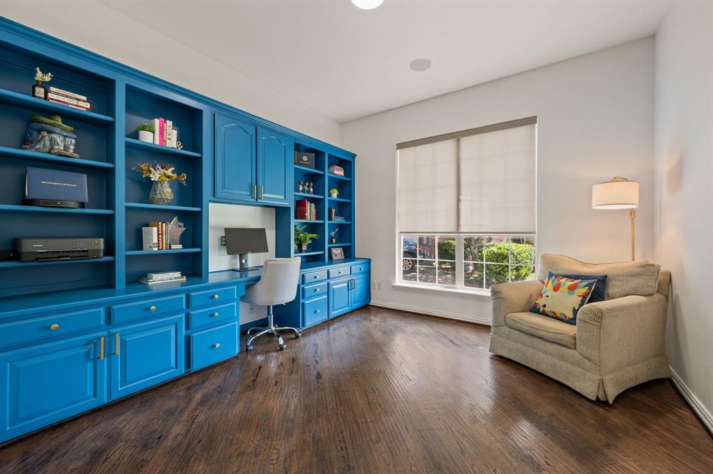 2038 Azalea Trail Irving, TX 75063 - Photo 22 of 39 a living room with furniture and a book shelf