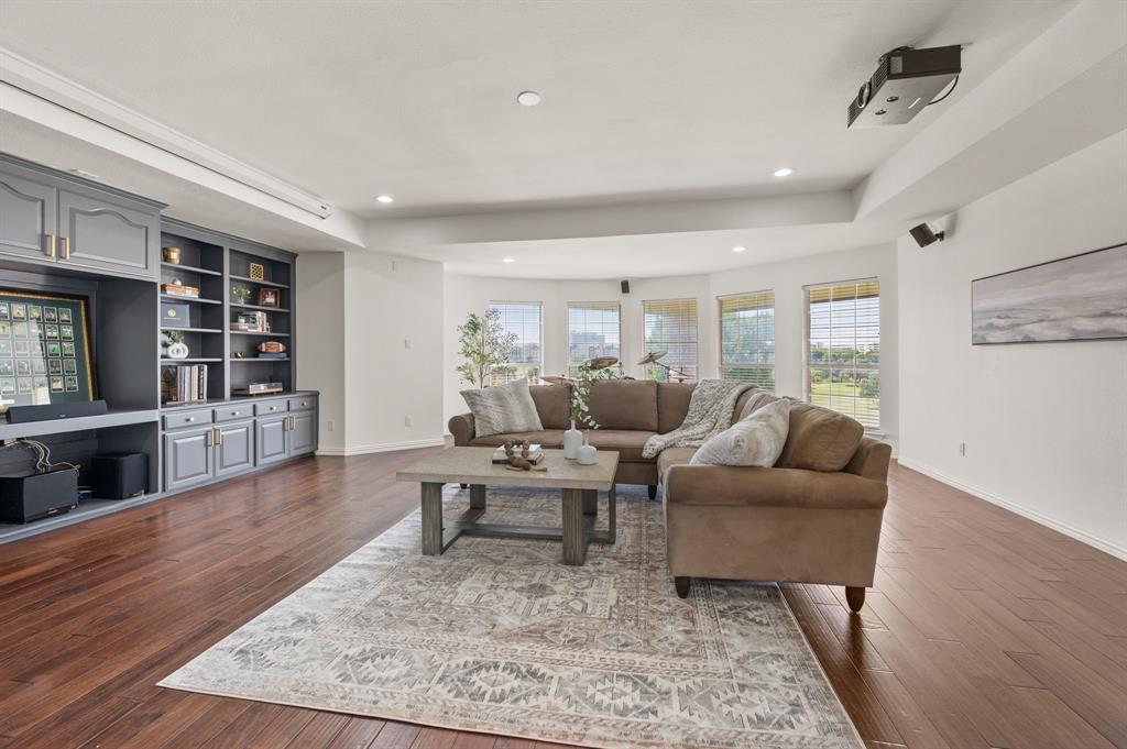 2038 Azalea Trail Irving, TX 75063 - Photo 25 of 39 a living room with furniture and a wooden floor
