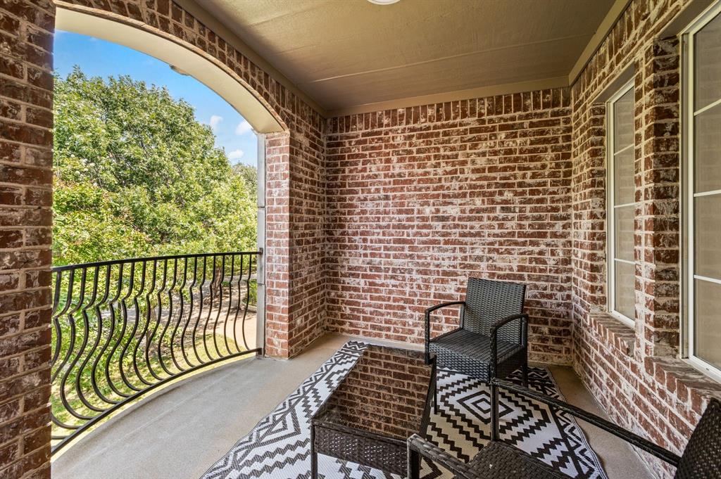 2038 Azalea Trail Irving, TX 75063 - Photo 30 of 39 a view of a balcony with wooden chairs