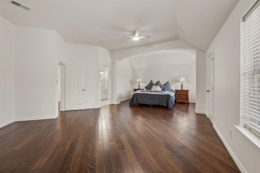 2038 Azalea Trail Irving, TX 75063 - Photo 31 of 39 a view of a livingroom with wooden floor and furniture