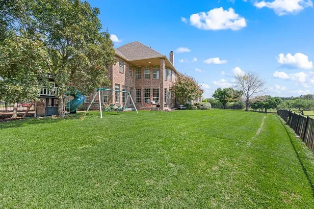 a view of a house with a big yard