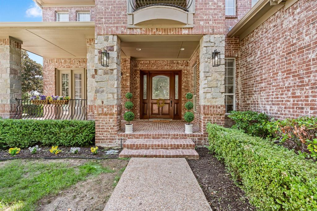 2038 Azalea Trail Irving, TX 75063 - Photo 6 of 39 a front view of a house with a garden
