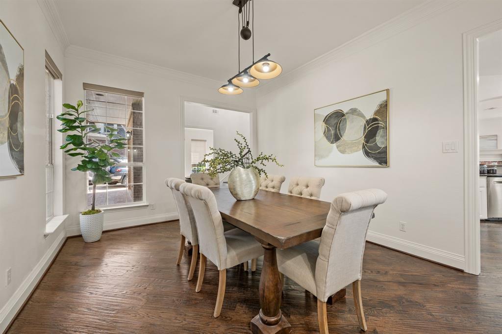 2038 Azalea Trail Irving, TX 75063 - Photo 10 of 39 a view of a dining room with furniture and wooden floor
