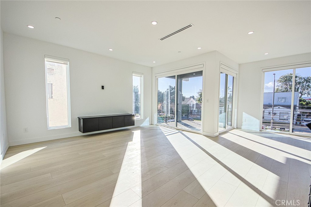 2202 Thurman Avenue Los Angeles, CA 90016 - Photo 18 of 25 a spacious bedroom with a large bed and a large window