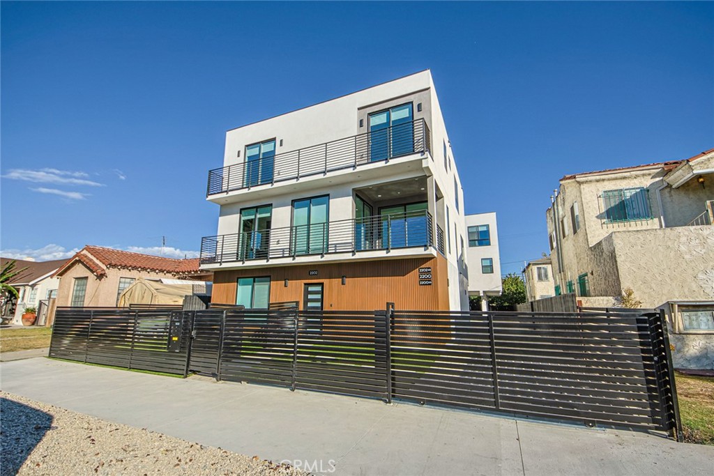 2202 Thurman Avenue Los Angeles, CA 90016 - Photo 21 of 25 a front view of a house with a street
