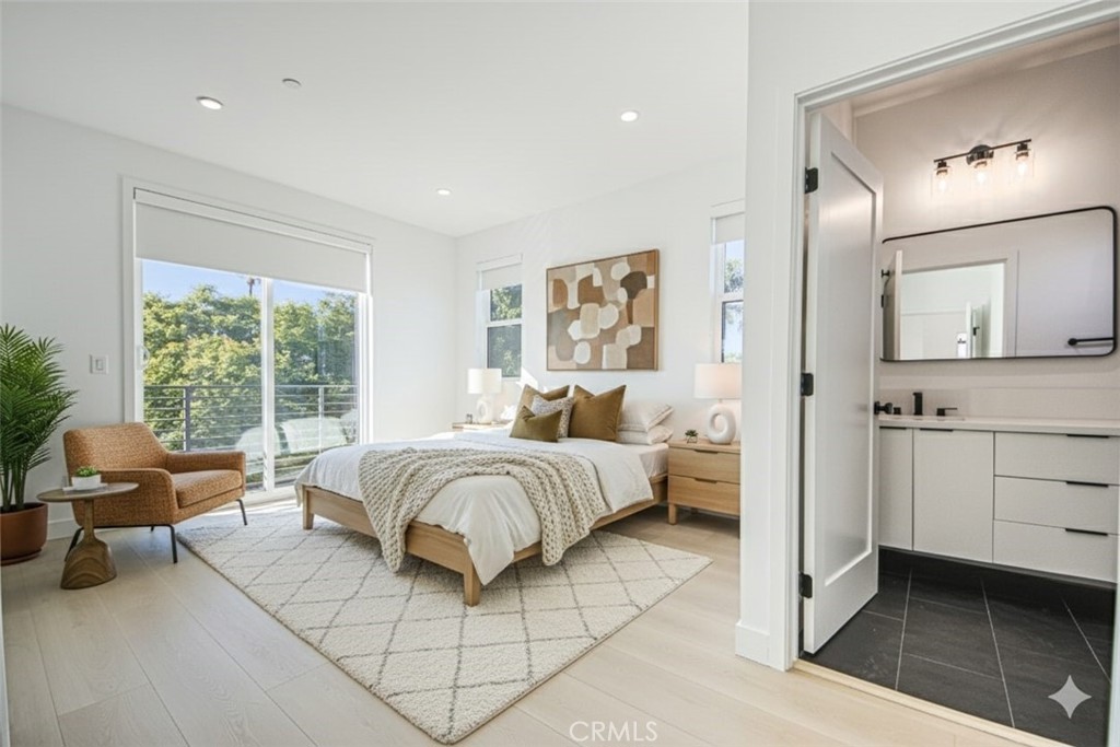 2202 Thurman Avenue Los Angeles, CA 90016 - Photo 3 of 25 a spacious bedroom with a bed and large windows