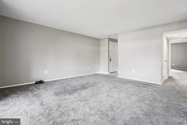 a view of an empty room and entryway