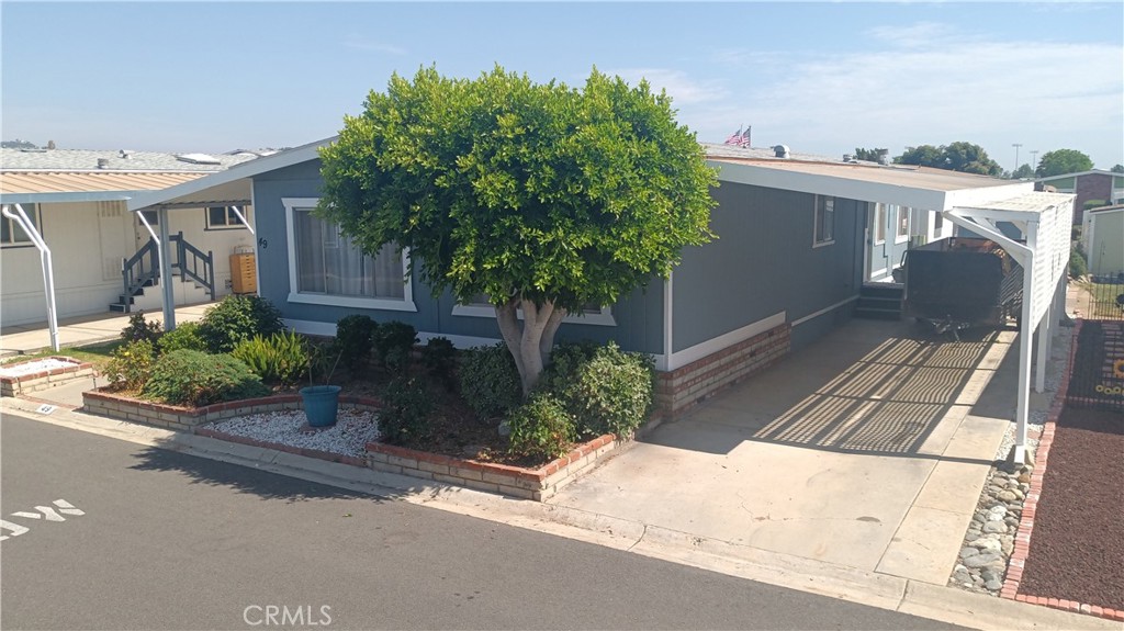 692 North Adele Street, Unit 49 Orange, CA 92867 - Photo 2 of 2 front view of a house with a yard