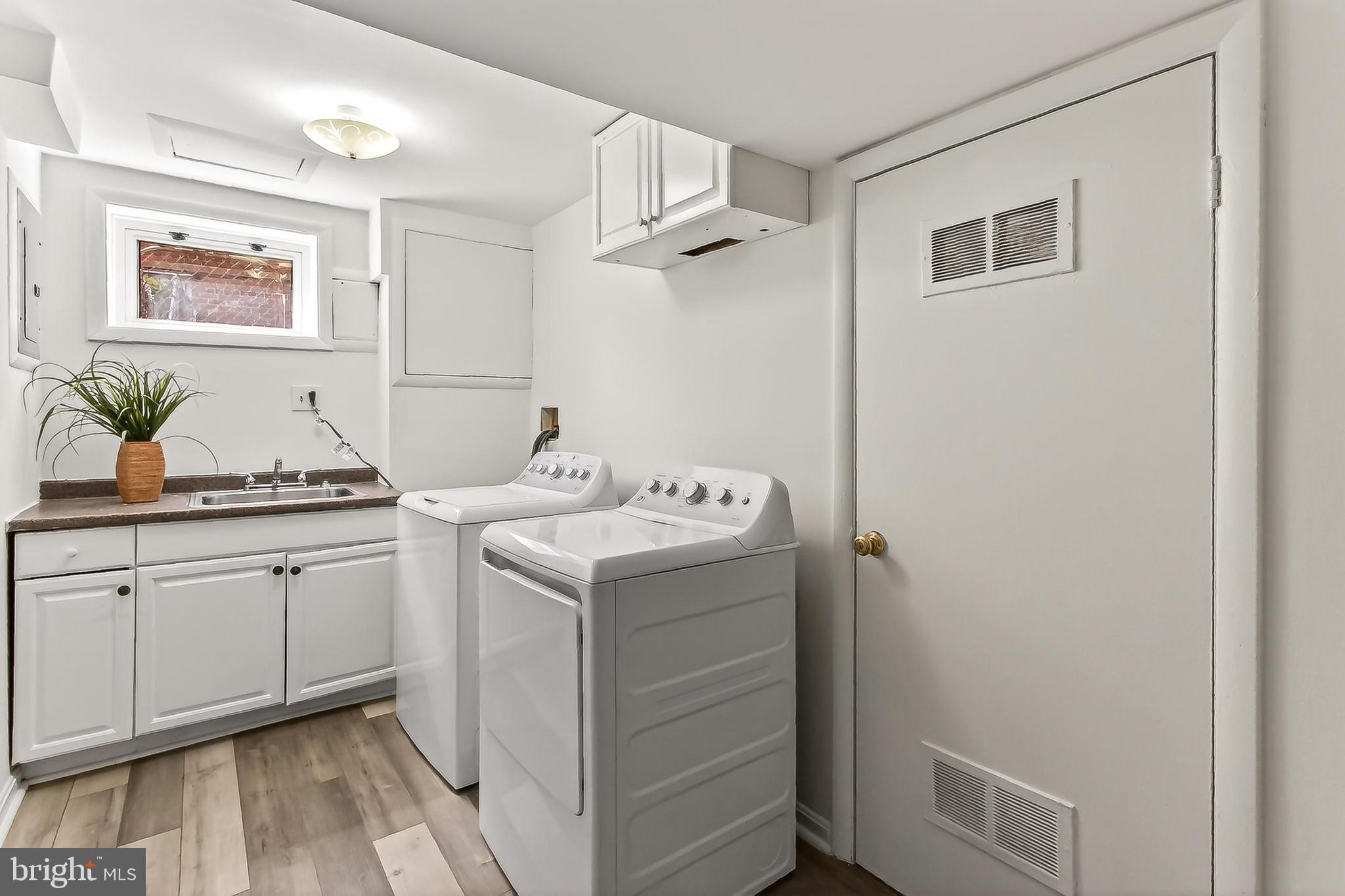 5213 11th Street Northeast Washington, DC 20011 - Photo 24 of 50 Functional Laundry area with ample cabinetry