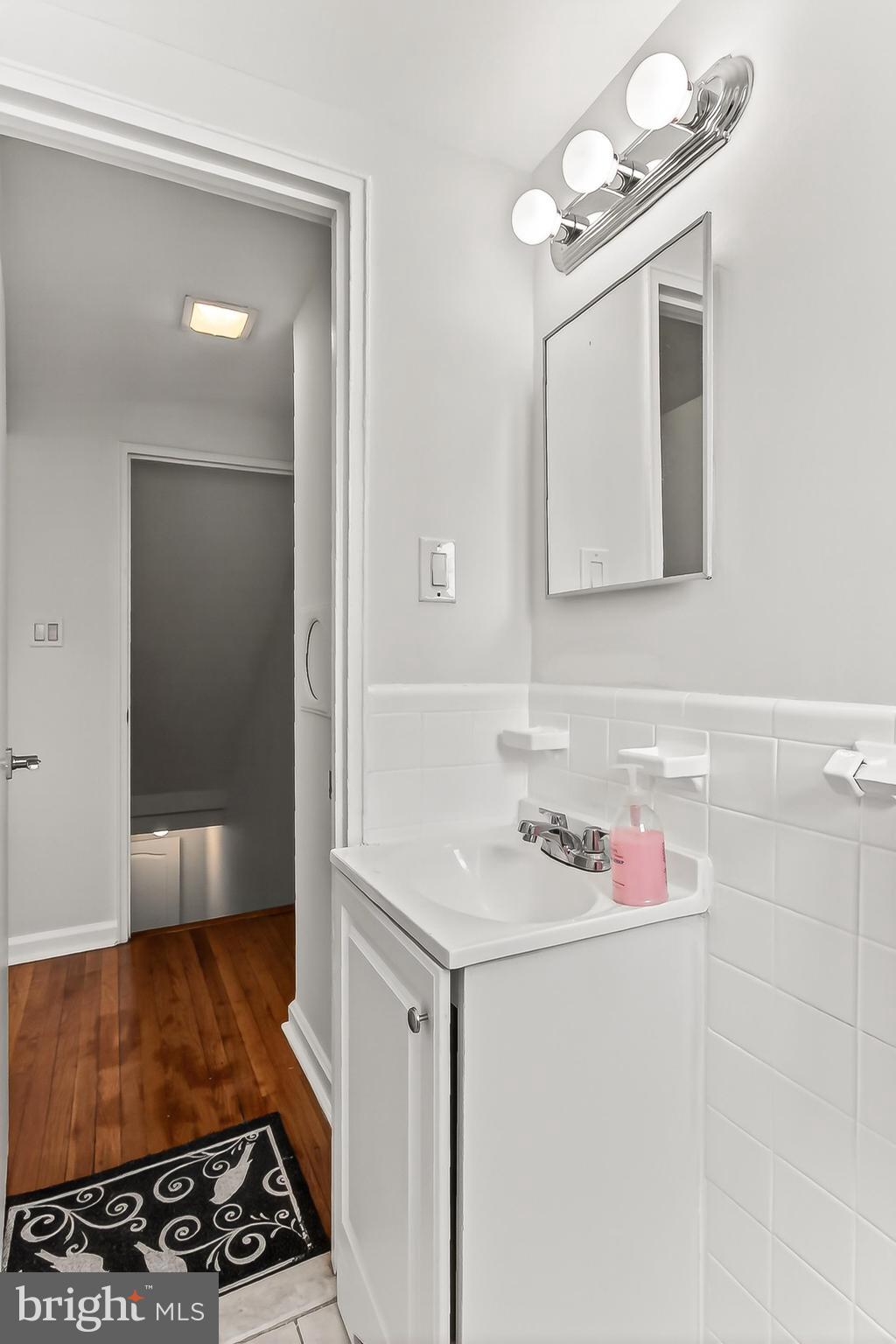 5213 11th Street Northeast Washington, DC 20011 - Photo 35 of 50 Upper level bathroom with modern vanity and lights