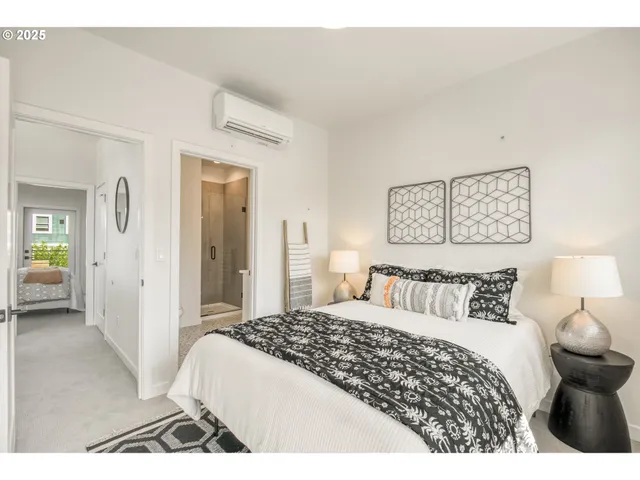 a bedroom with a bed and a view of bathroom