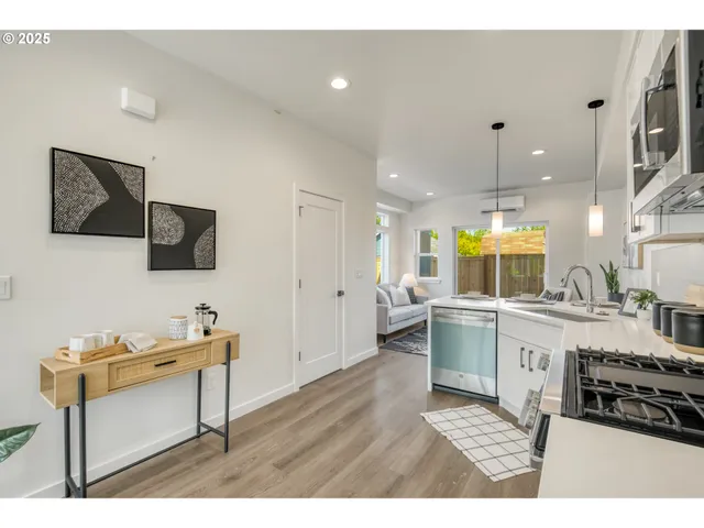 a kitchen with stainless steel appliances kitchen island granite countertop a sink and cabinets