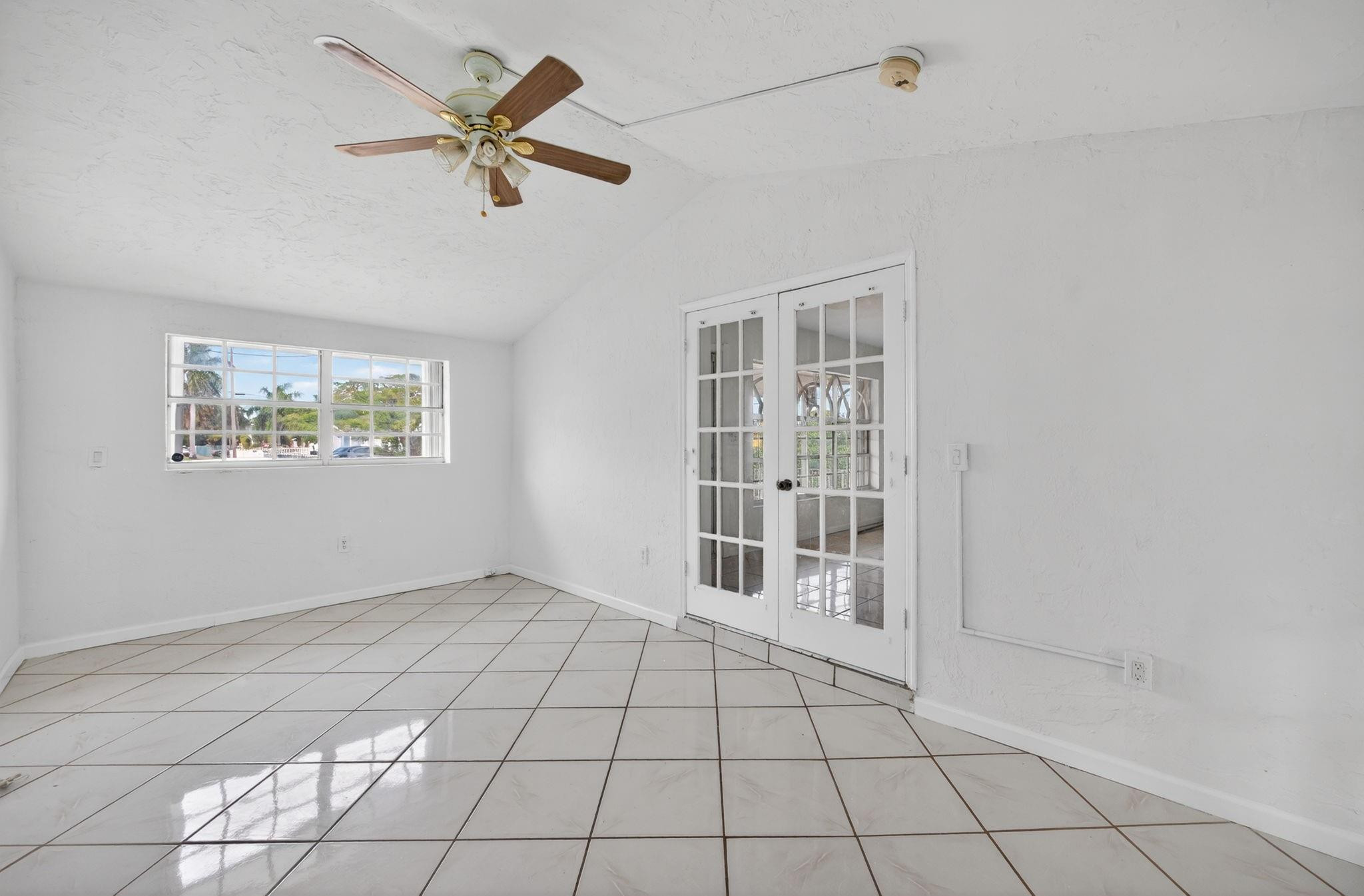 11720 Southwest 176th Street Miami, FL 33177 - Photo 11 of 31 a view of an empty room with a window