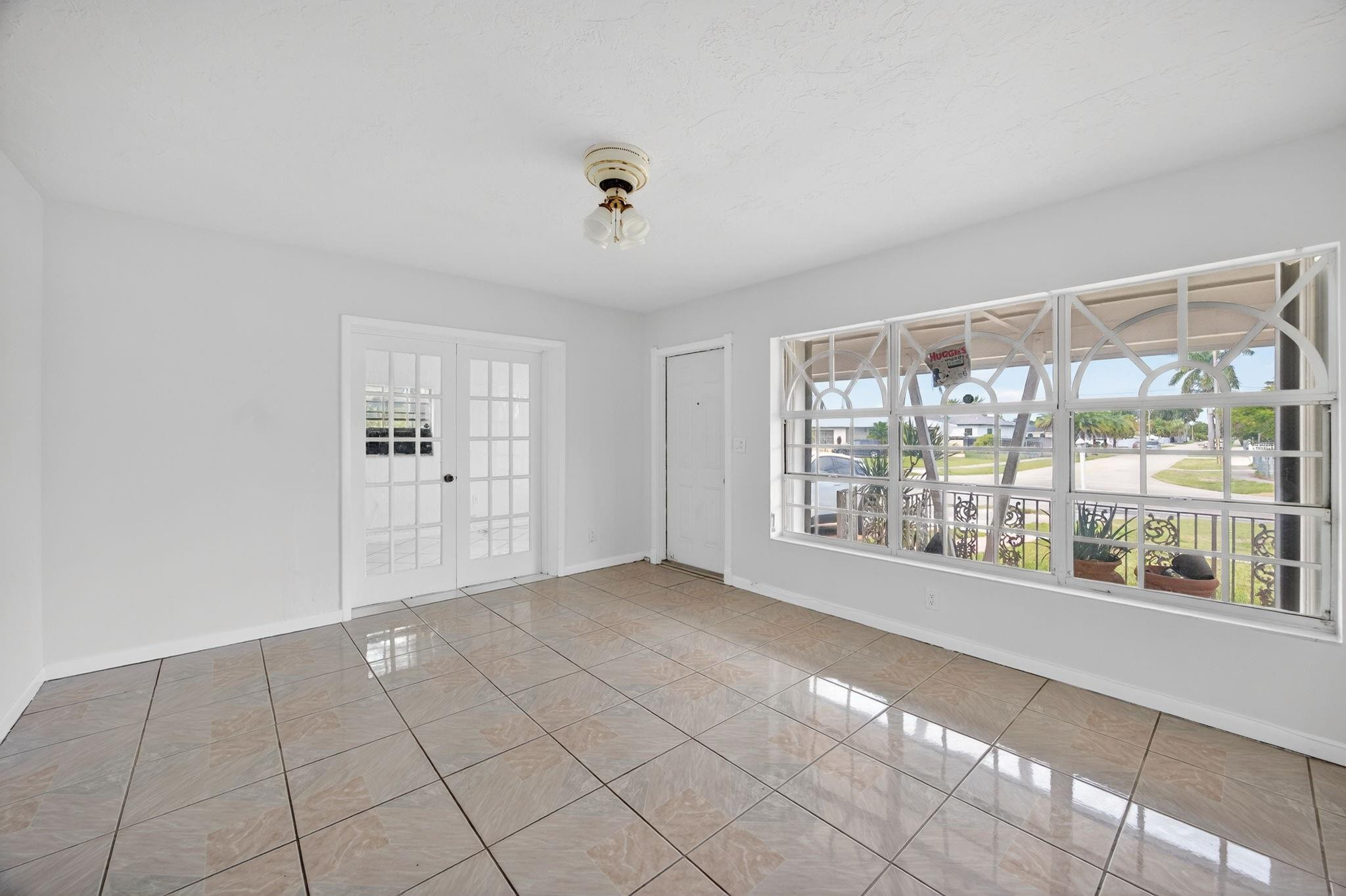 11720 Southwest 176th Street Miami, FL 33177 - Photo 14 of 31 a view of an empty room with a window