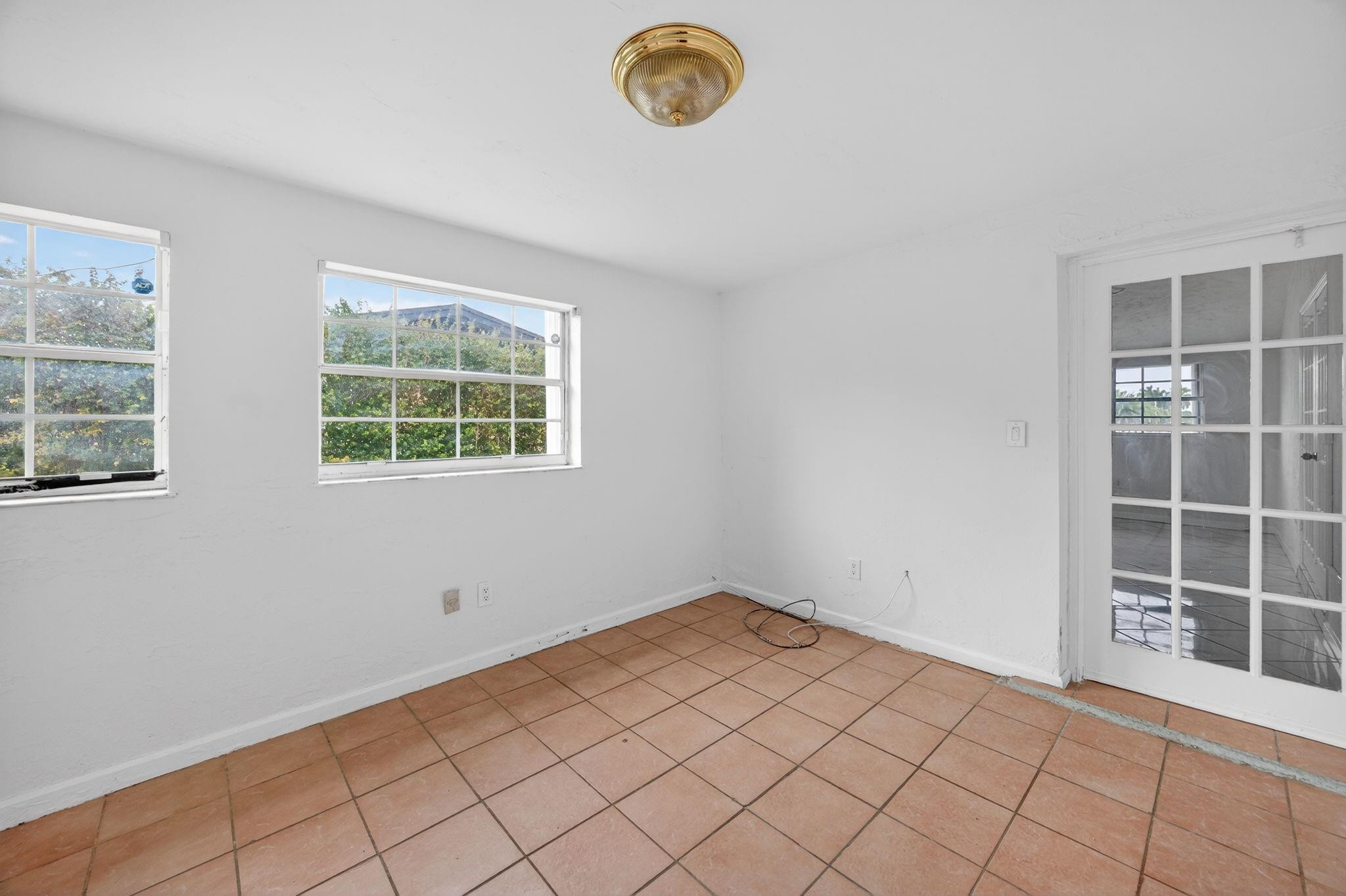 11720 Southwest 176th Street Miami, FL 33177 - Photo 21 of 31 an empty room with windows