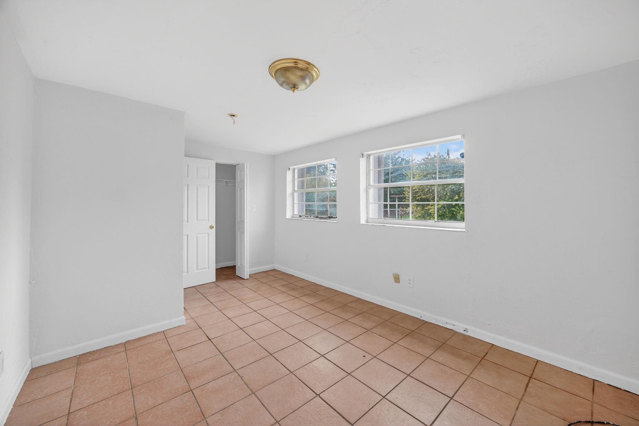 11720 Southwest 176th Street Miami, FL 33177 - Photo 22 of 31 a view of an empty room with windows
