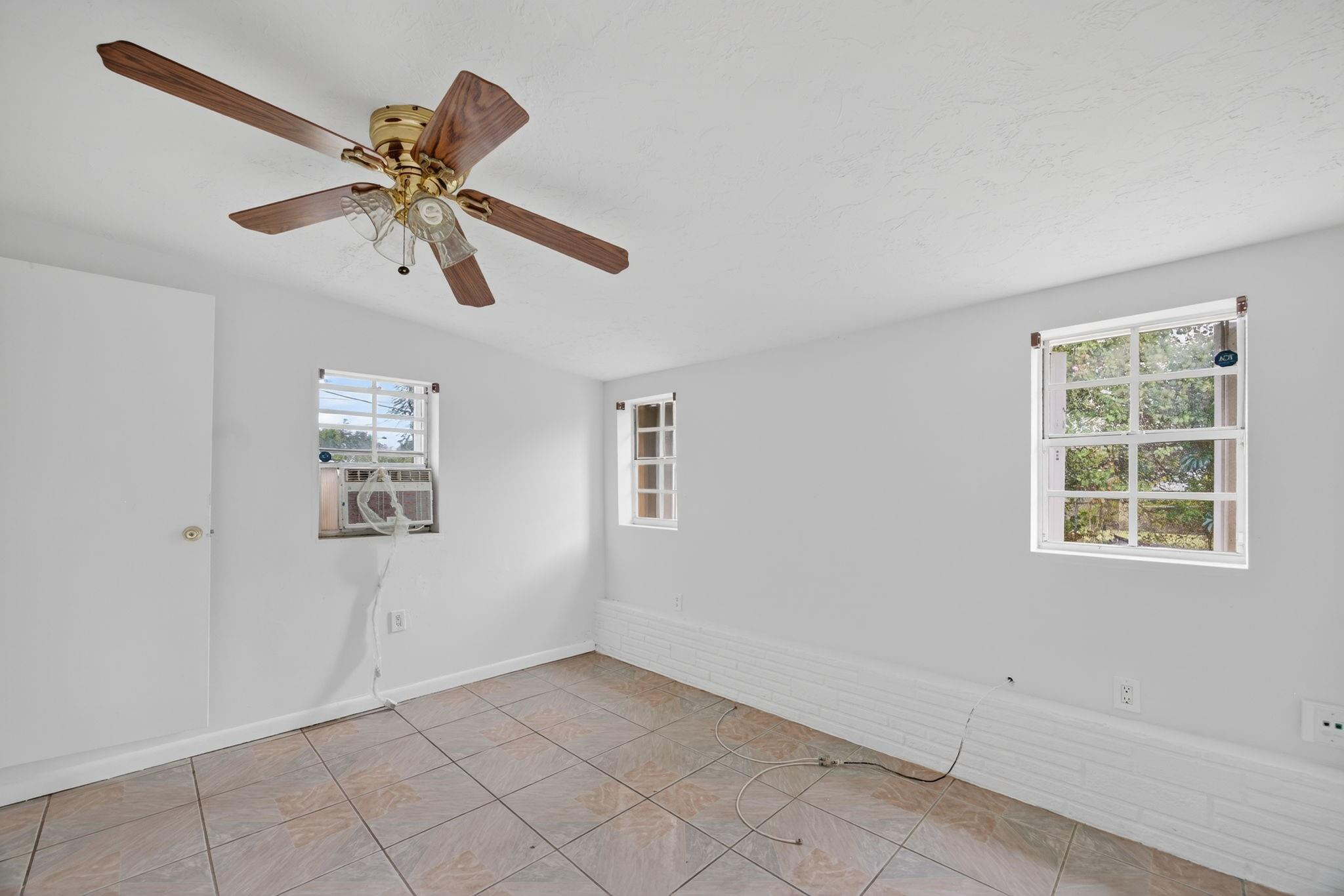 11720 Southwest 176th Street Miami, FL 33177 - Photo 24 of 31 a view of an empty room with a window