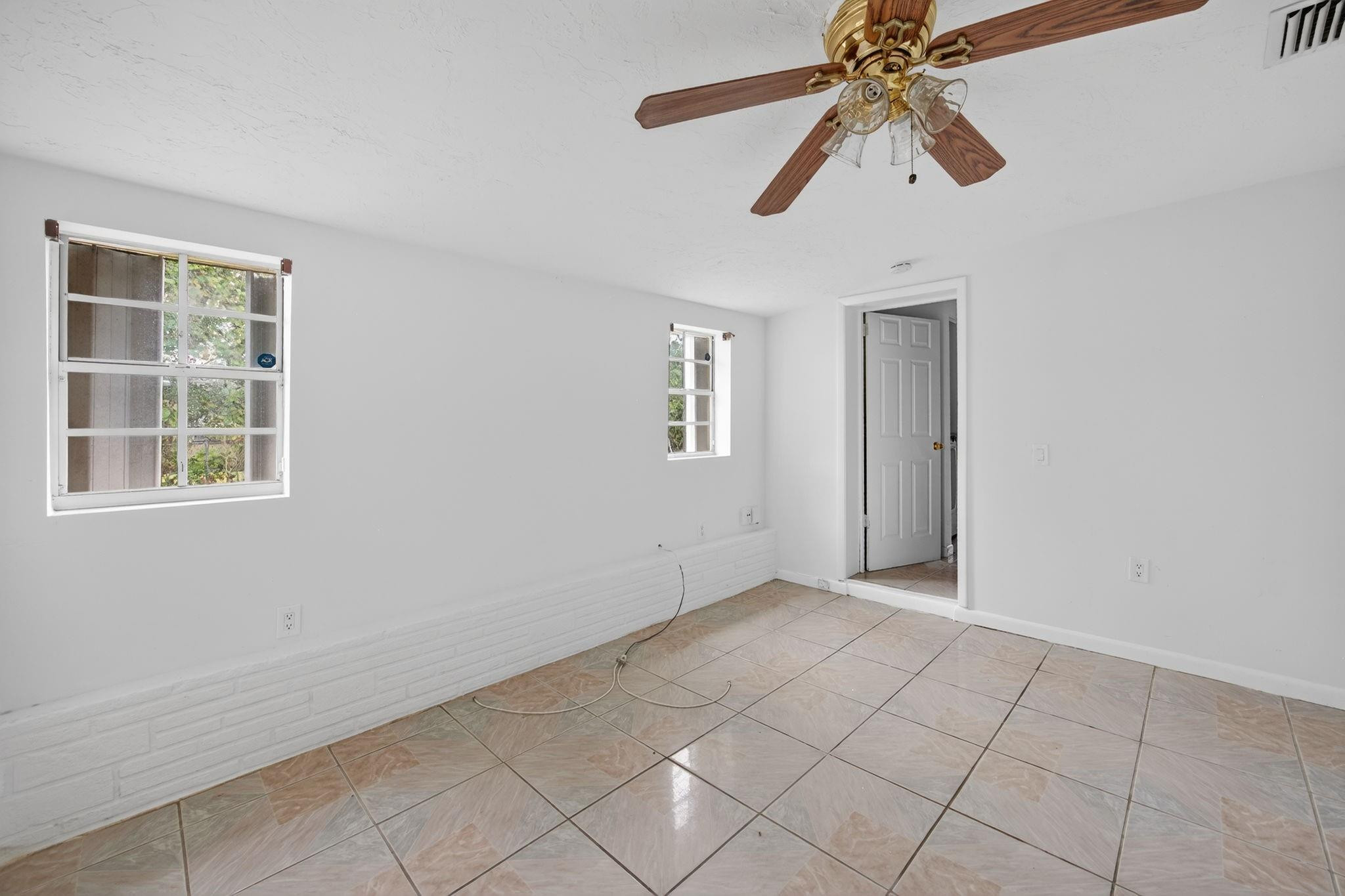 11720 Southwest 176th Street Miami, FL 33177 - Photo 25 of 31 a view of an empty room with a window