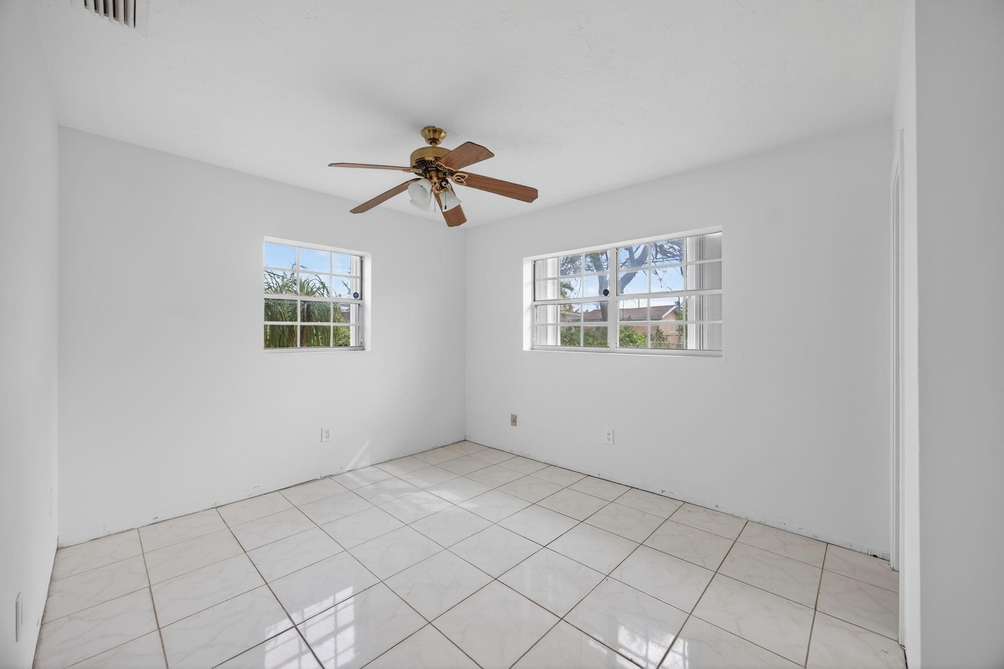 11720 Southwest 176th Street Miami, FL 33177 - Photo 26 of 31 a view of an empty room with a window