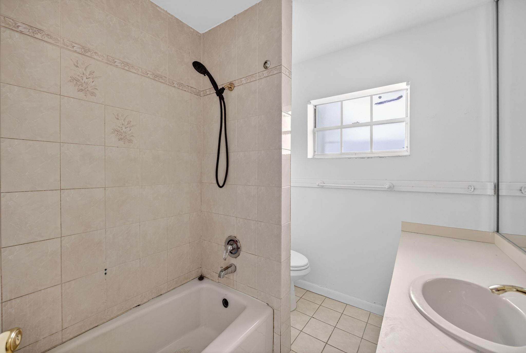 11720 Southwest 176th Street Miami, FL 33177 - Photo 30 of 31 a bathroom with a sink a toilet and shower