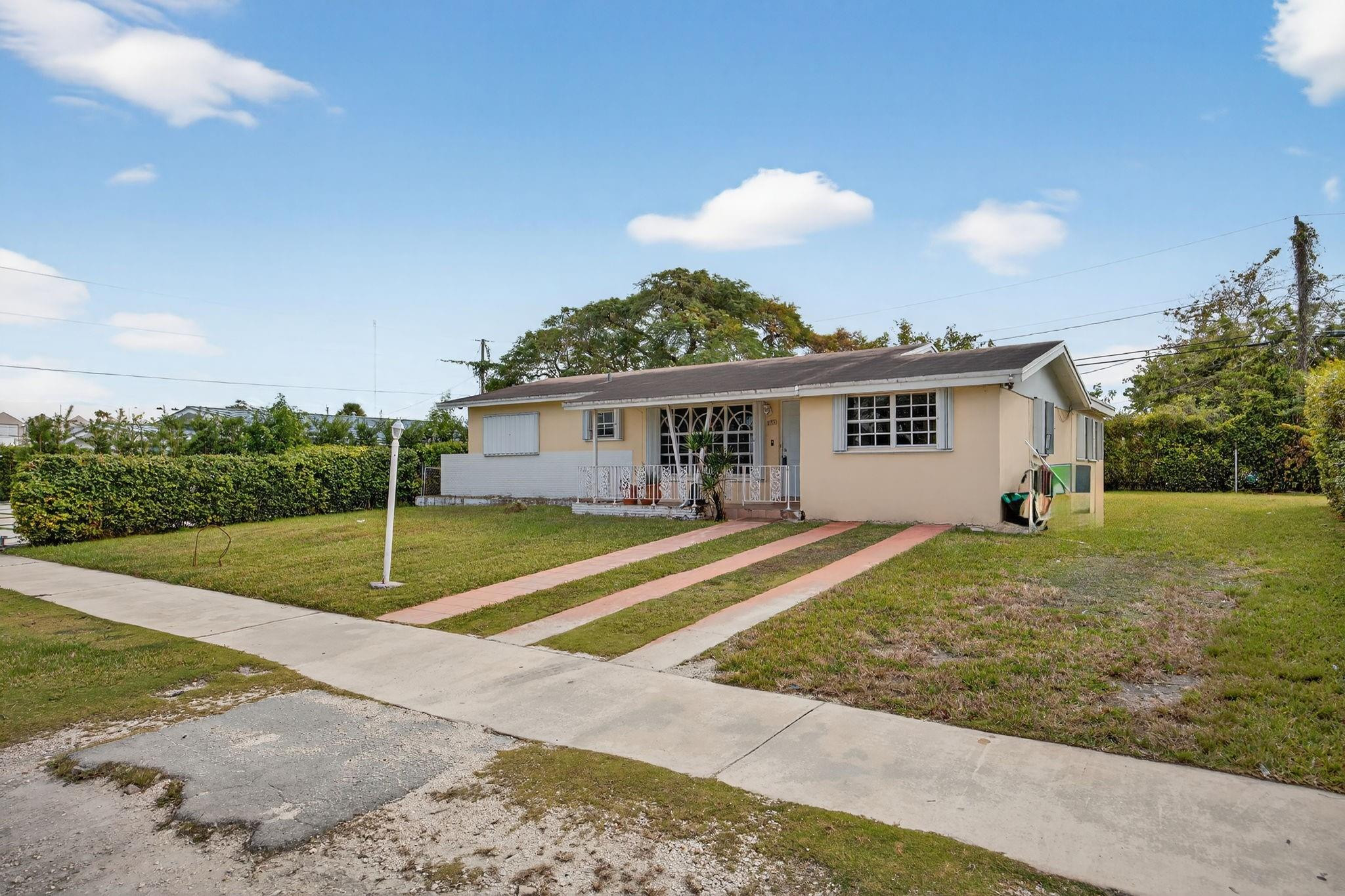 11720 Southwest 176th Street Miami, FL 33177 - Photo 4 of 31 a view of a house with backyard and trees