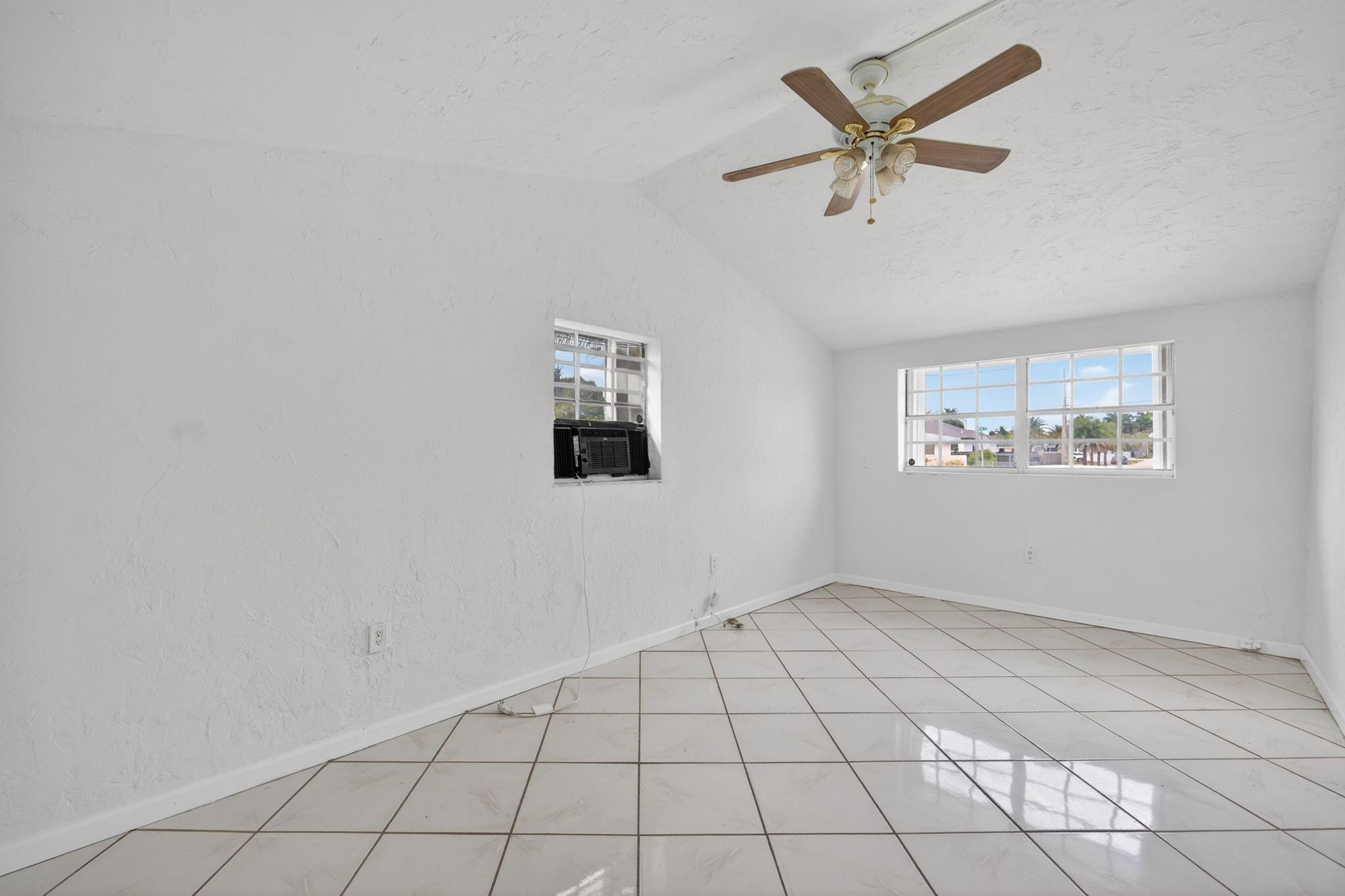 11720 Southwest 176th Street Miami, FL 33177 - Photo 10 of 31 a view of an empty room and a window